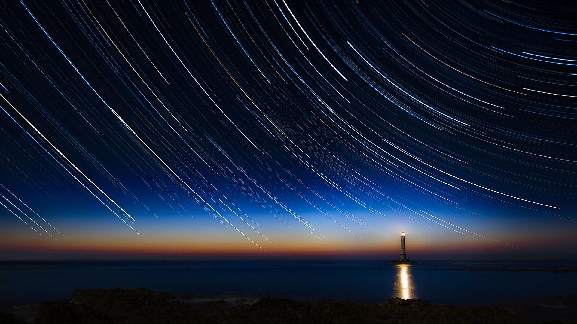 2017-04 Circumpolar trails sunset at La Hague lighthouse